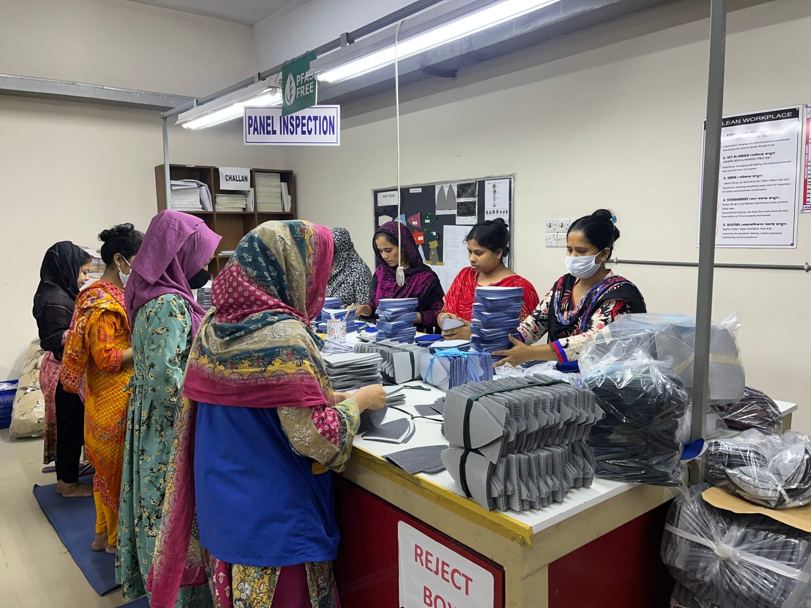 Factory team reviewing a private label hats brief